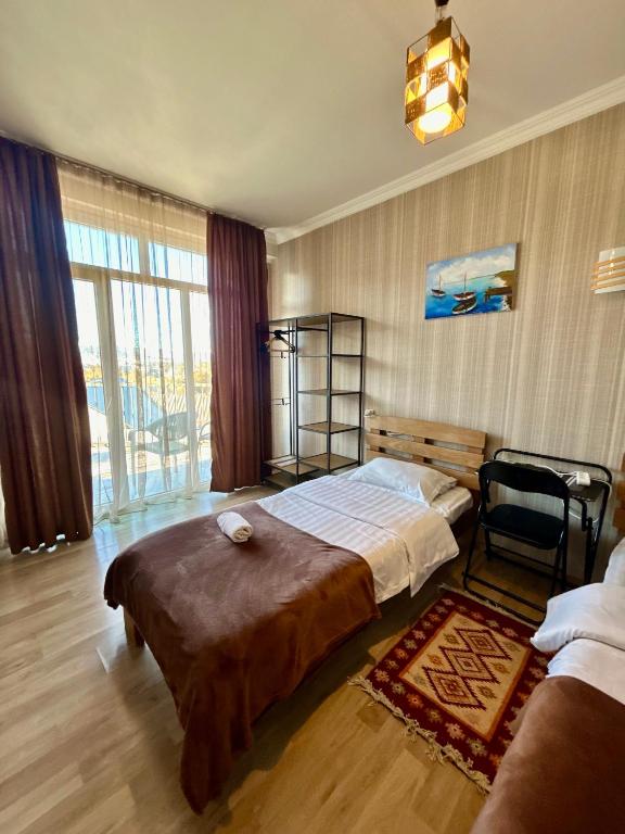 Postel nebo postele na pokoji v ubytování Hotel Marioni