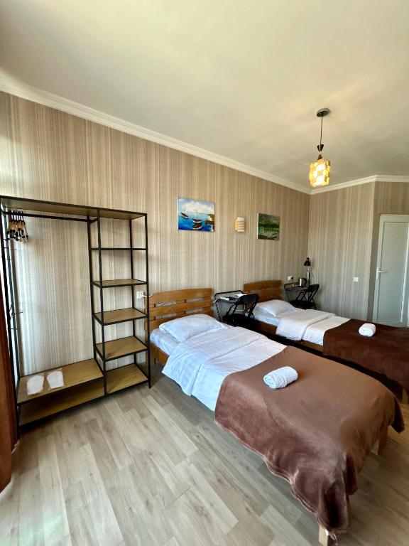 Postel nebo postele na pokoji v ubytování Hotel Marioni