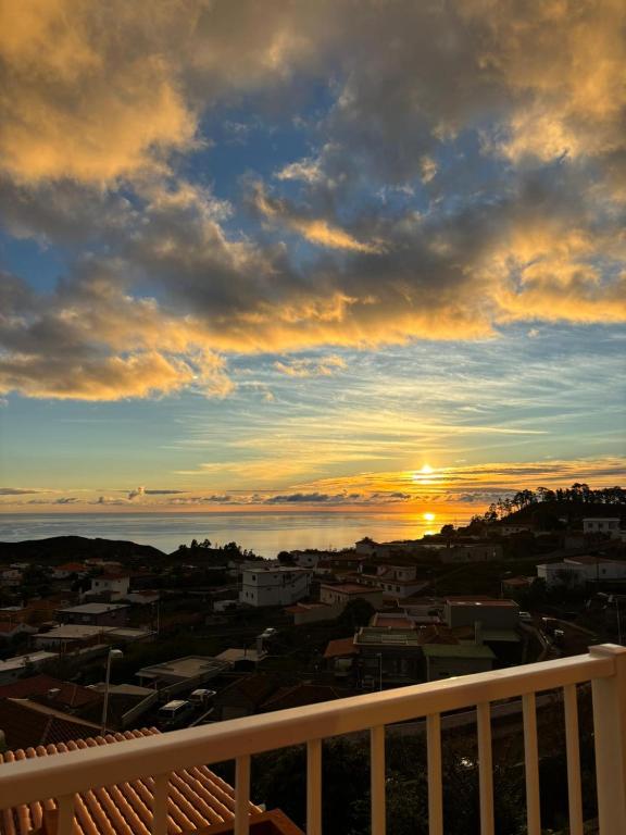 a view of the sunset from the balcony of a building at Casa Caronehe in Fuencaliente de la Palma