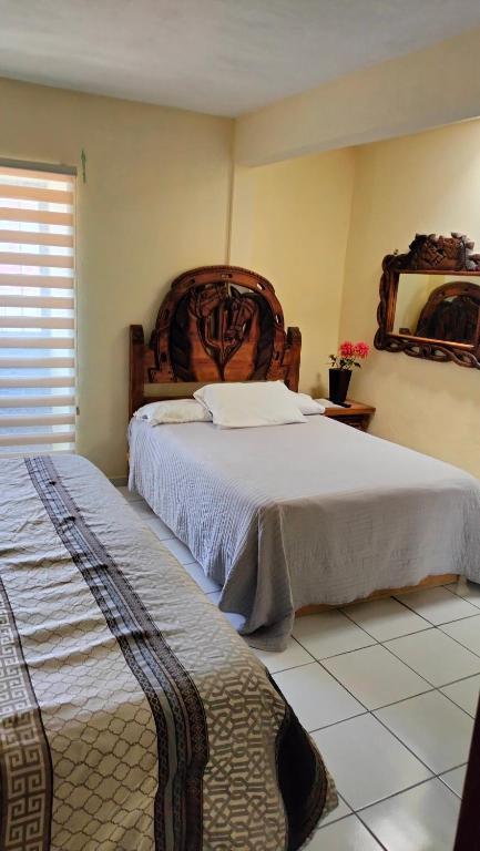 Postel nebo postele na pokoji v ubytování Hotel Chely