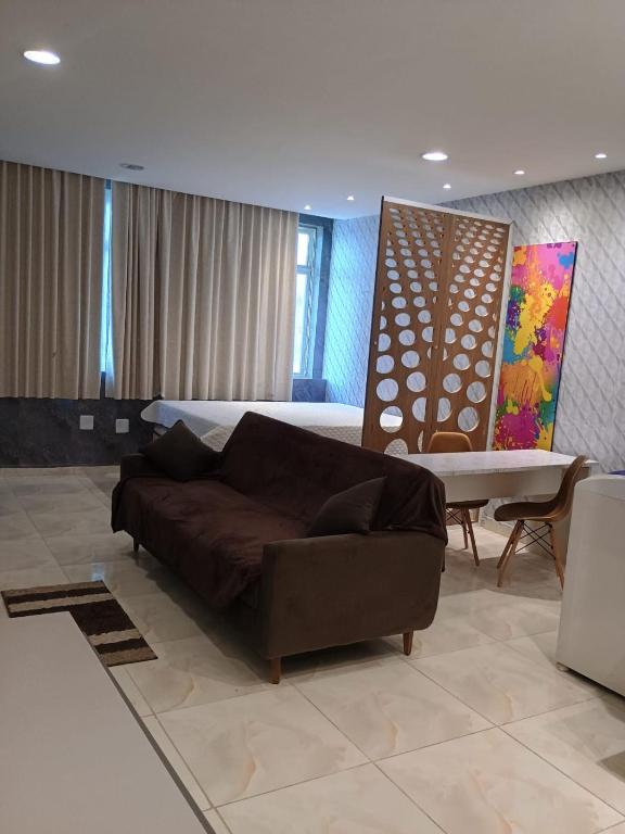 a living room with a couch and a table at Apto Pelourinho Centro Histórico in Salvador