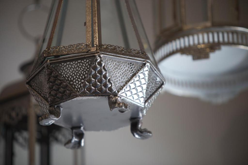 a close up of a light hanging from a ceiling at Jawi Peranakan Mansion in George Town