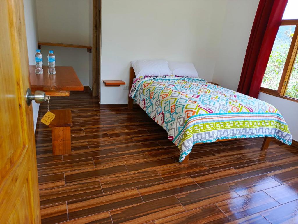 Postel nebo postele na pokoji v ubytování CABAÑAS GOLDEN TANAGER