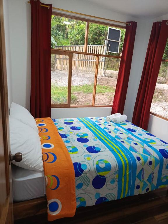Postel nebo postele na pokoji v ubytování CABAÑAS GOLDEN TANAGER