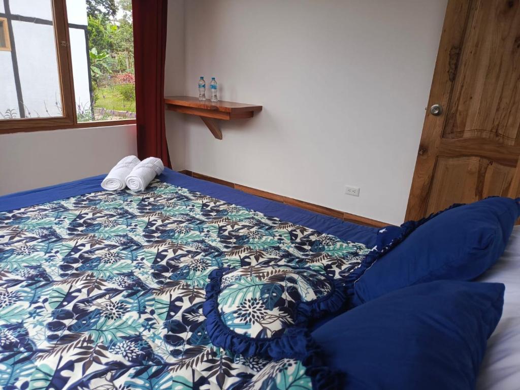 Postel nebo postele na pokoji v ubytování CABAÑAS GOLDEN TANAGER