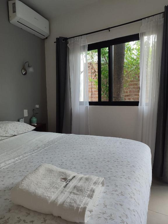 Postel nebo postele na pokoji v ubytování Hostal Casa Morada