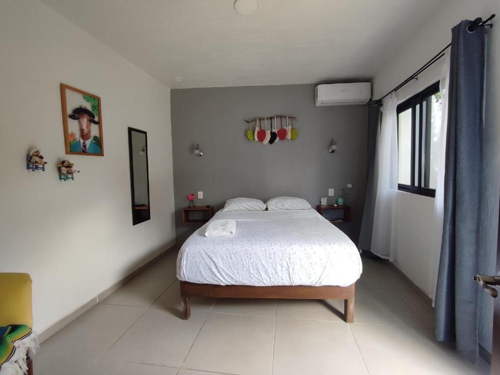 Postel nebo postele na pokoji v ubytování Hostal Casa Morada