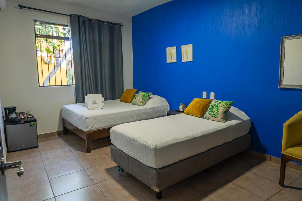 Postel nebo postele na pokoji v ubytování Hostal Casa Morada