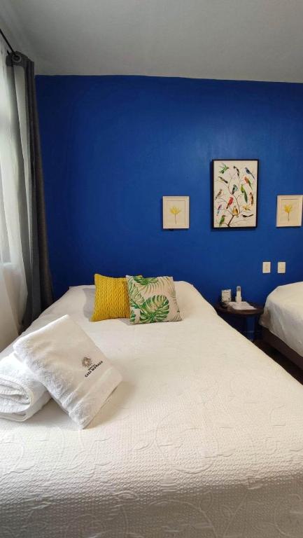 Postel nebo postele na pokoji v ubytování Hostal Casa Morada