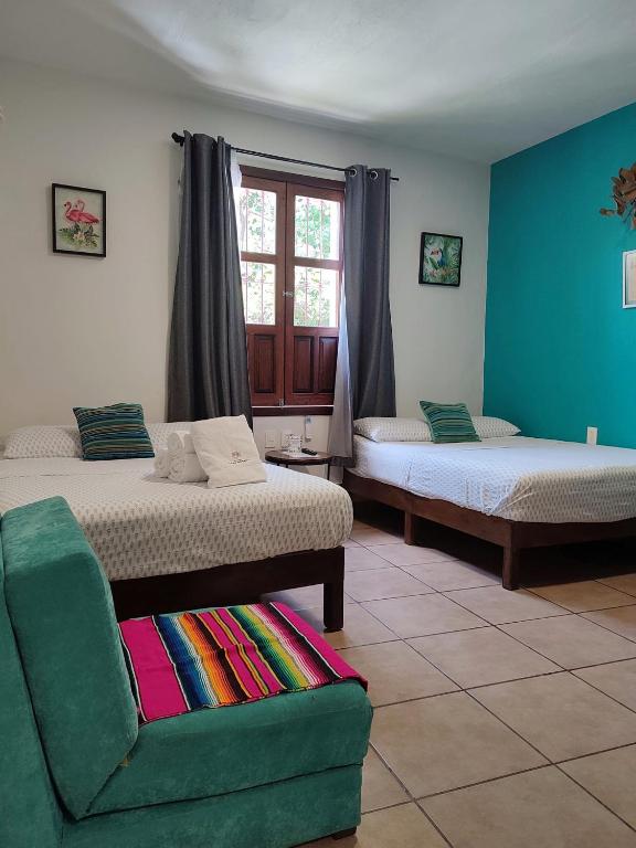 Postel nebo postele na pokoji v ubytování Hostal Casa Morada