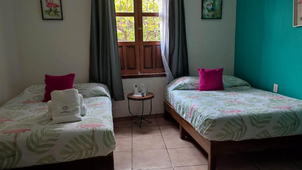 Postel nebo postele na pokoji v ubytování Hostal Casa Morada