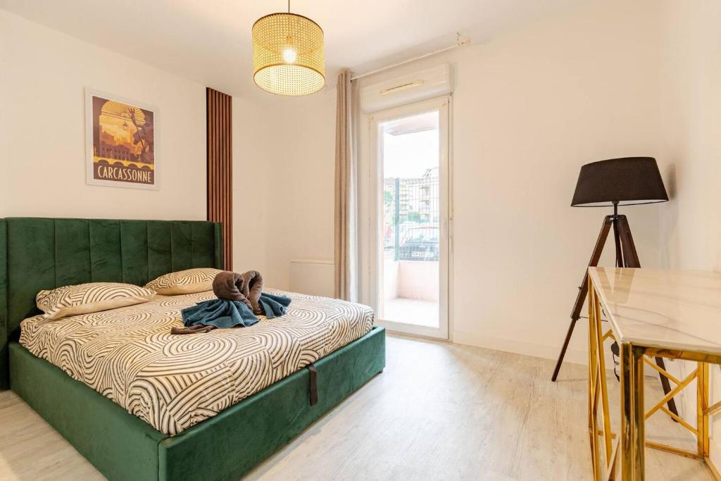 Ένα ή περισσότερα κρεβάτια σε δωμάτιο στο Le Cosy Bernard , Parking, Piscine, Netflix
