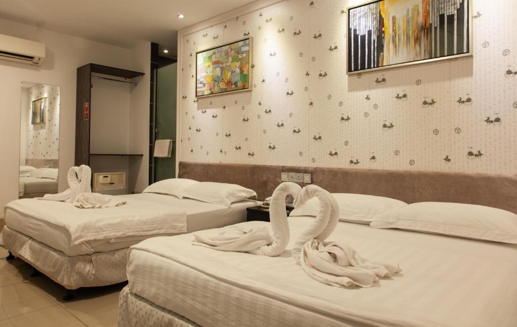 Postel nebo postele na pokoji v ubytování M Design Hotel @ Seri Kembangan