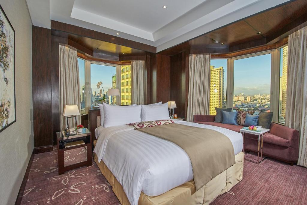 Ένα ή περισσότερα κρεβάτια σε δωμάτιο στο Diamond Hotel Philippines
