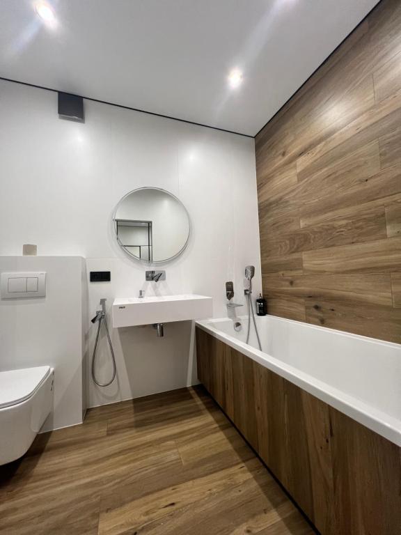 a bathroom with a sink and a mirror at Апартаменти в районі АВТОВОКЗАЛУ Поблизу Обласноі лікарні ЖК Great House,ЖК Арена in Rivne