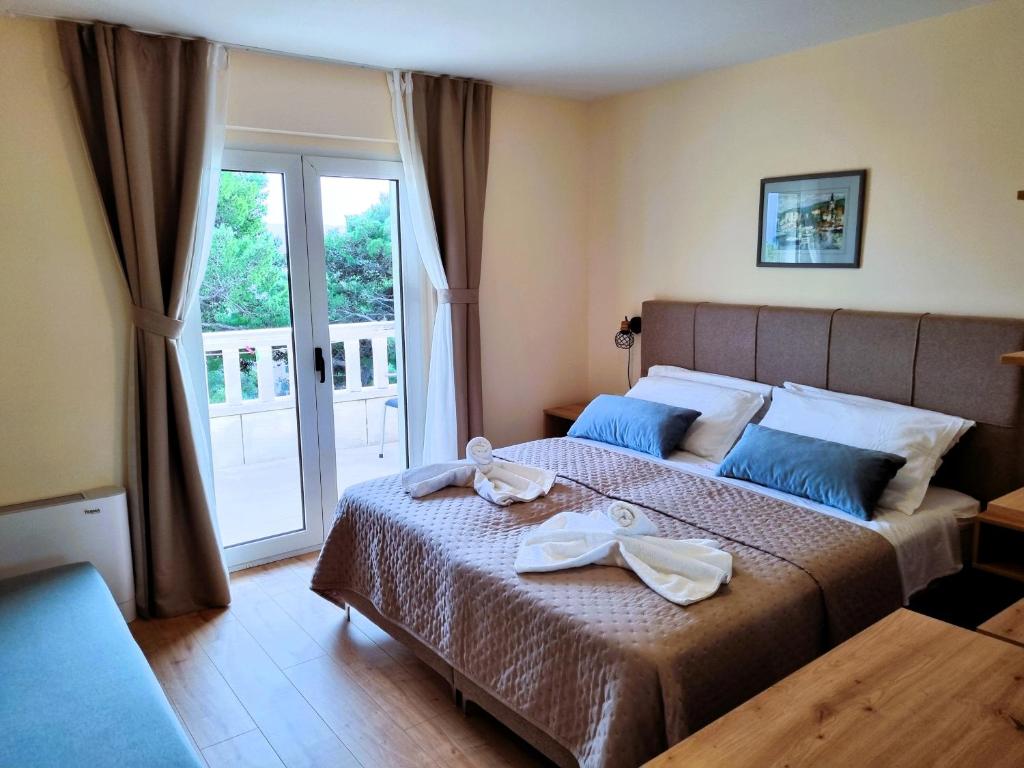 Postel nebo postele na pokoji v ubytování Villa Daniela