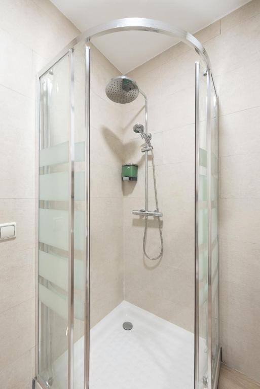 A bathroom at Apartamentos Day Madrid SANTO DOMINGO Centro Gran Via Sol Malasaña