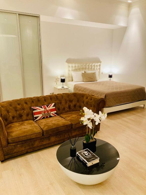 a living room with a couch and a bed at Royal Residence in Old Town in Staré Mesto