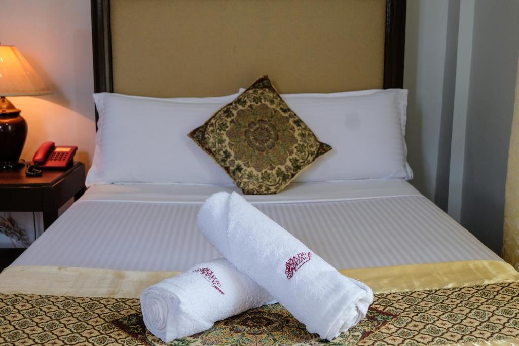 Postel nebo postele na pokoji v ubytování PATIO RIZAL HOTEL Inc