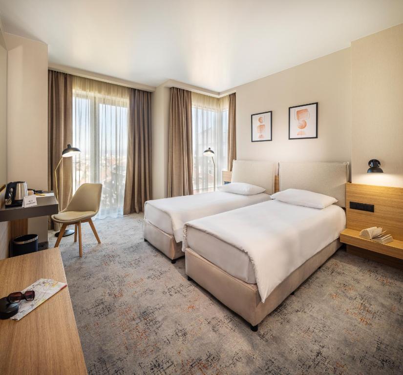 Postel nebo postele na pokoji v ubytování B1 Downtown Hotel