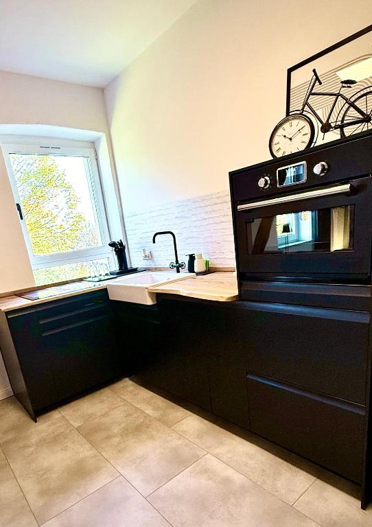 Kuchyň nebo kuchyňský kout v ubytování Suburban Loft