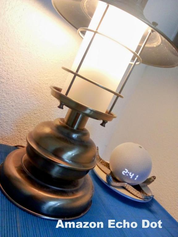 a lamp on a table with a ball on it at Apartment Mediterraneo Blue Sky in Perast