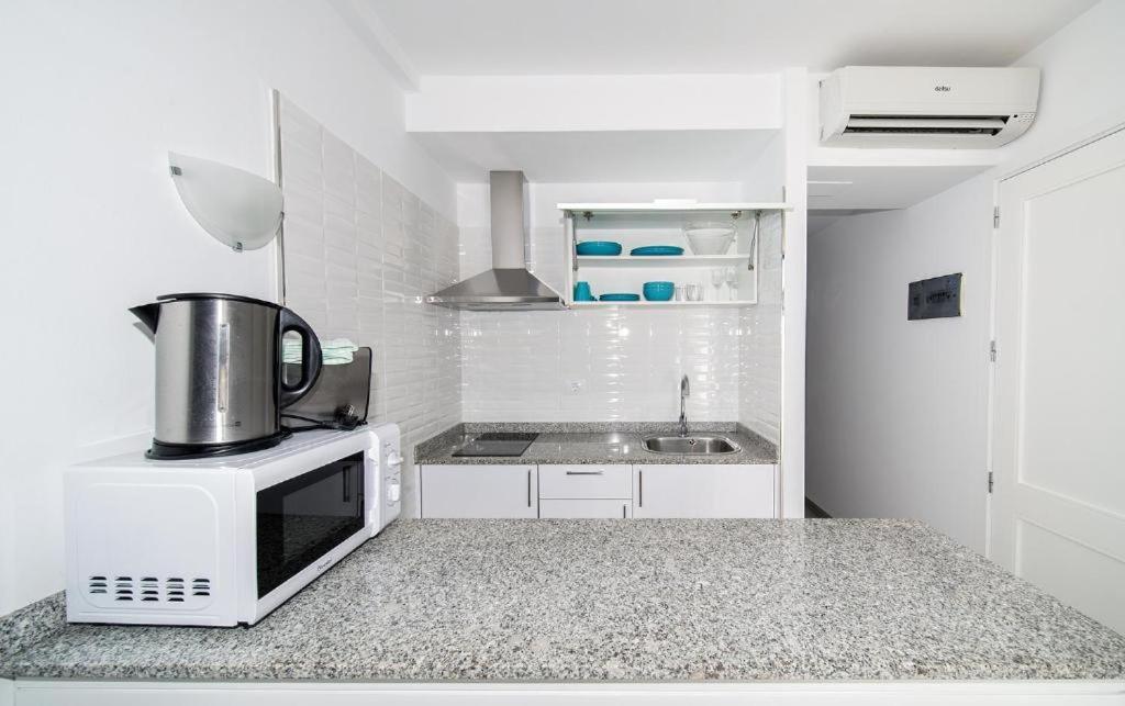 Kuchyň nebo kuchyňský kout v ubytování Apartamentos Monte Verde