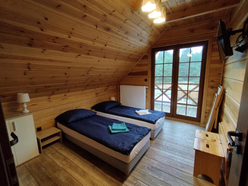 Postel nebo postele na pokoji v ubytování Chata Sosenka