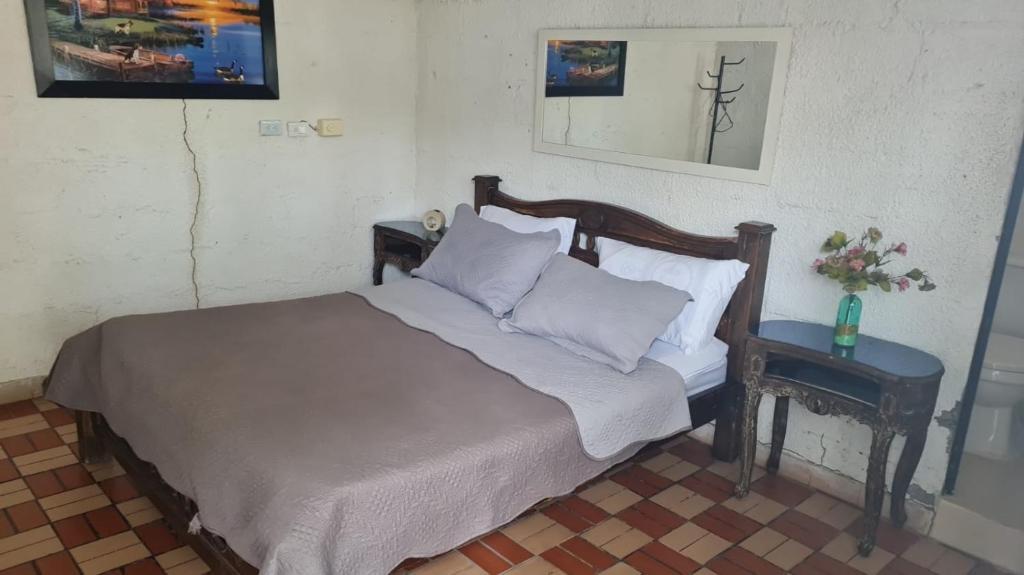Ένα ή περισσότερα κρεβάτια σε δωμάτιο στο Siboney hotel