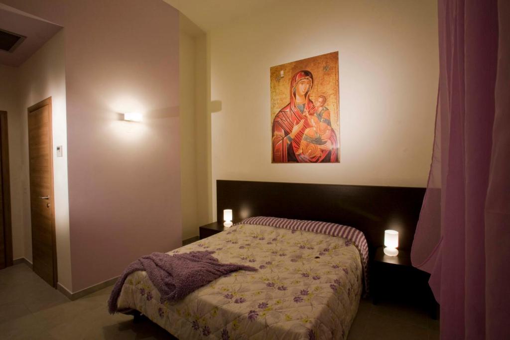 Postel nebo postele na pokoji v ubytování Santa Marta