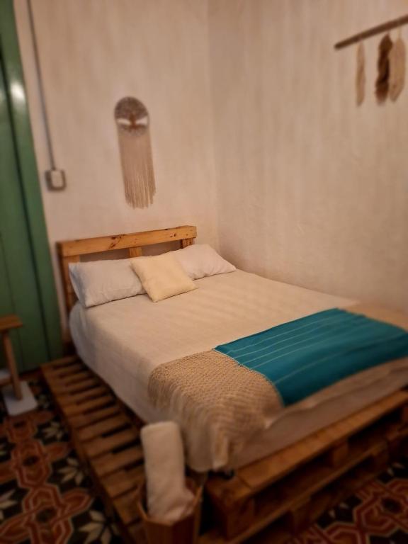 Postel nebo postele na pokoji v ubytování Hostal Prana