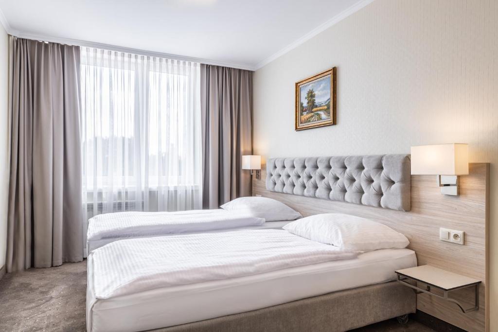 Postel nebo postele na pokoji v ubytování Hotel Podlasie