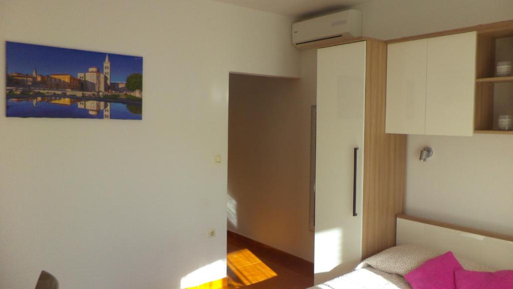 Postel nebo postele na pokoji v ubytování Apartments D&A