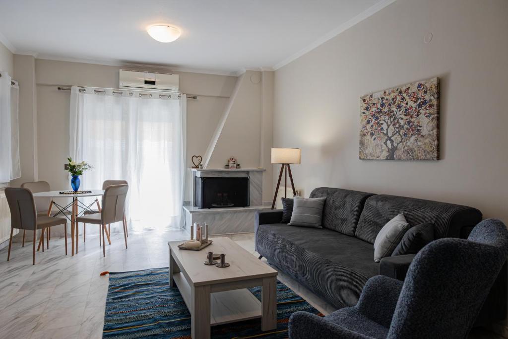 a living room with a couch and a table at Amaya apartment in Drama