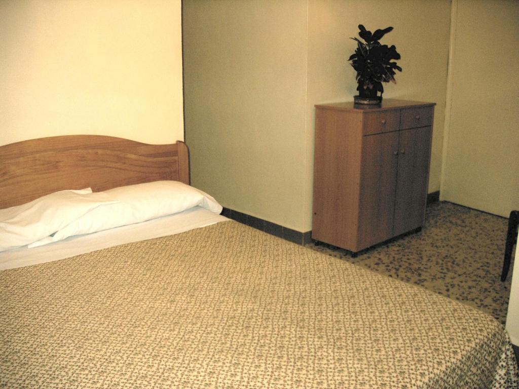 Postel nebo postele na pokoji v ubytování Hotel La Parra