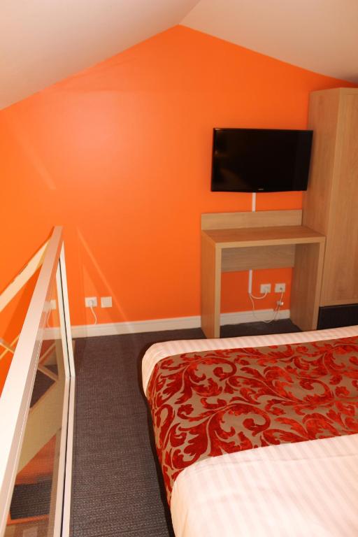 Postel nebo postele na pokoji v ubytování Royal Cottage