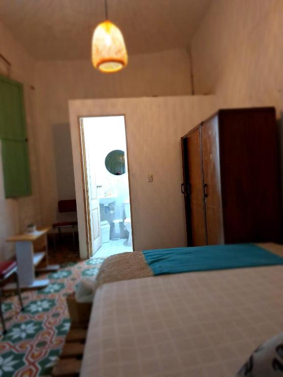 Postel nebo postele na pokoji v ubytování Hostal Prana
