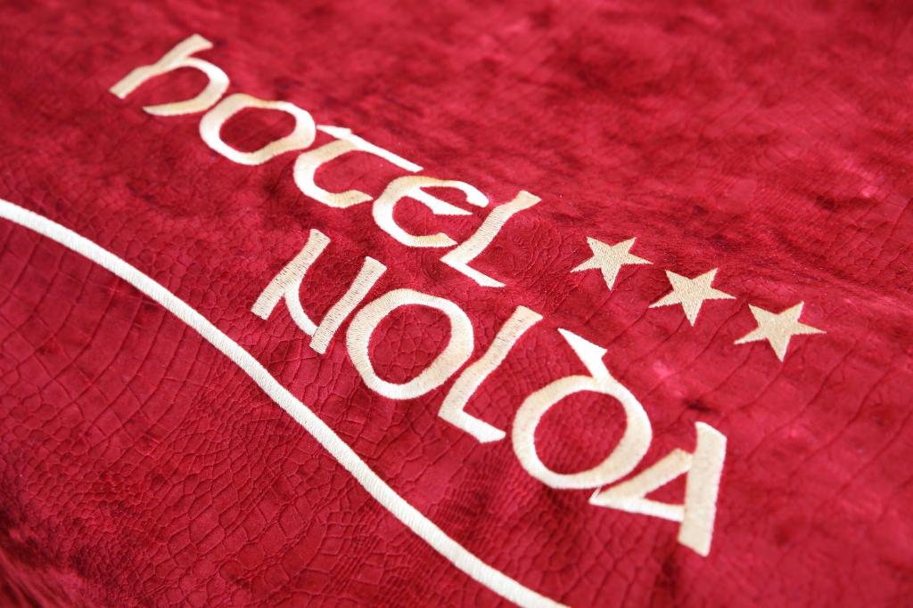 Certificato, attestato, insegna o altro documento esposto da Hotel Nolda