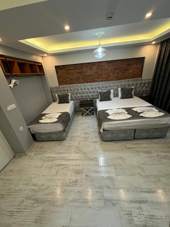 Postel nebo postele na pokoji v ubytování Arat Apartments