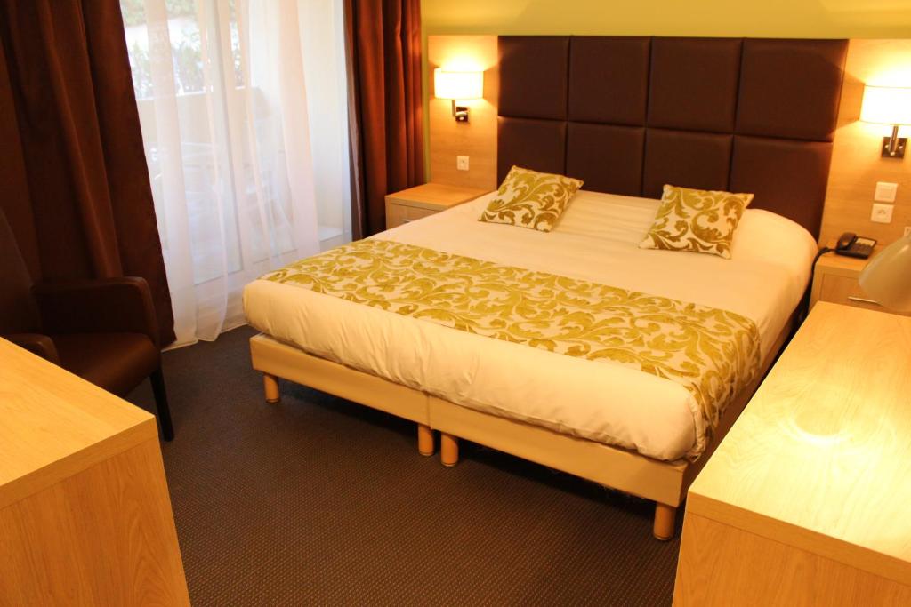 Postel nebo postele na pokoji v ubytování Royal Cottage