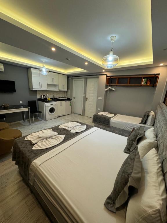 Postel nebo postele na pokoji v ubytování Arat Apartments