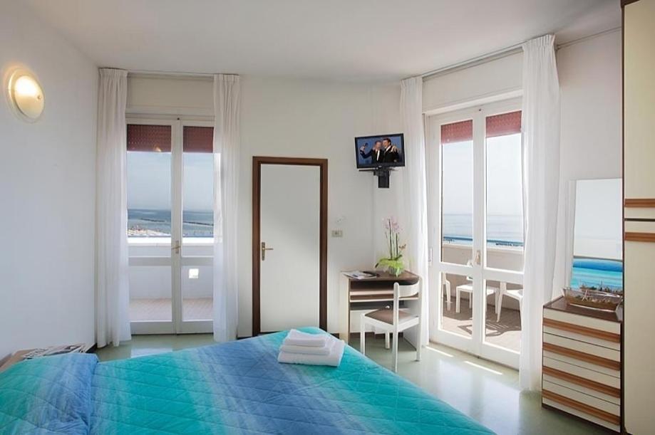 Postel nebo postele na pokoji v ubytování Hotel Concord