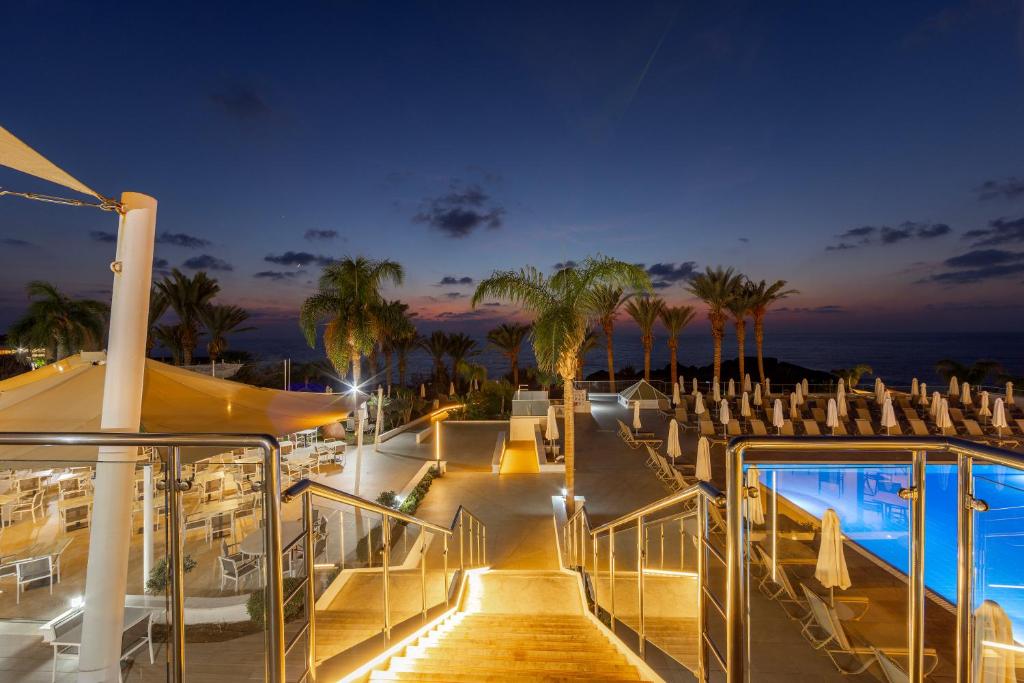 a view of a deck of a cruise ship at night at Queens Bay Hotel in Paphos