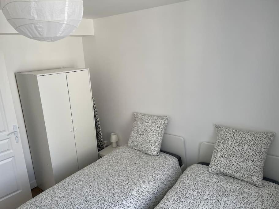 Postel nebo postele na pokoji v ubytování Appartement berges Oise