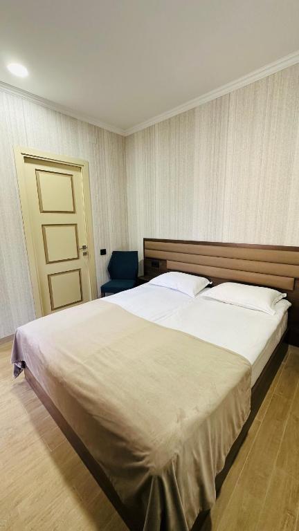 Postel nebo postele na pokoji v ubytování Marrone Hotel Tsaghkadzor