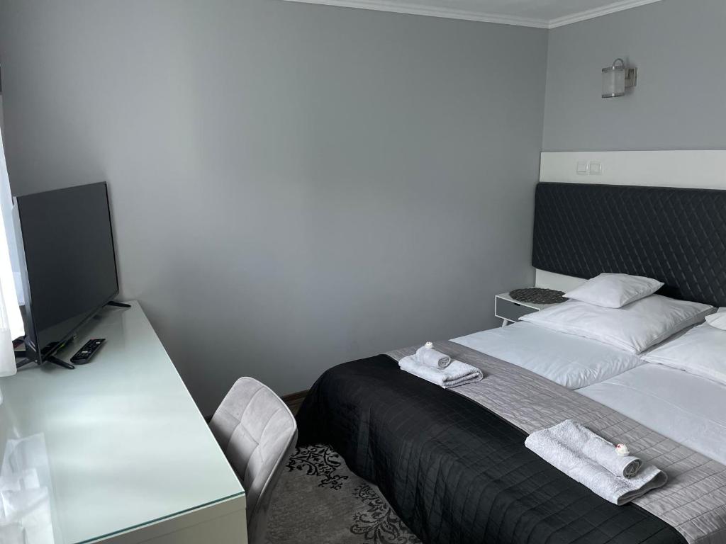 Posteľ alebo postele v izbe v ubytovaní Apartament Lazur