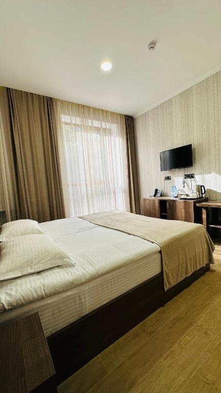 Postel nebo postele na pokoji v ubytování Marrone Hotel Tsaghkadzor