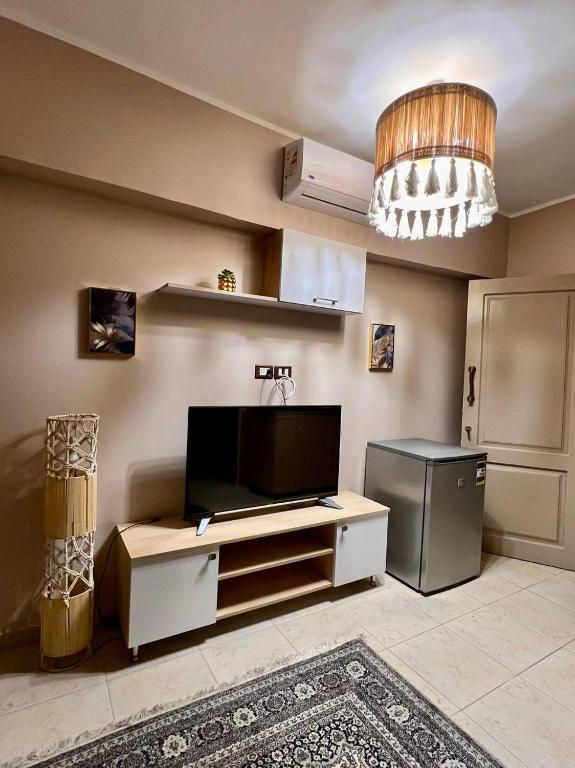 TV a/nebo společenská místnost v ubytování Paradise Studios