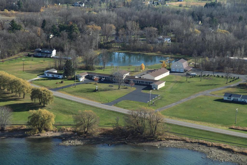 an aerial view of a house next to a lake at Lakeview Motel & Apartments in Massena