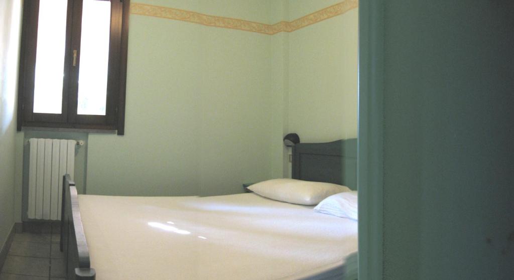 A bed or beds in a room at Residence Costamartino